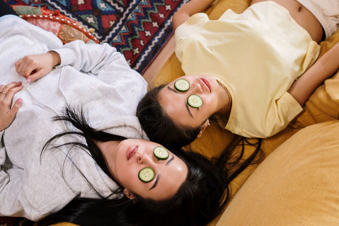 Two girls with cucumber eye masks doing their summer skincare routine
