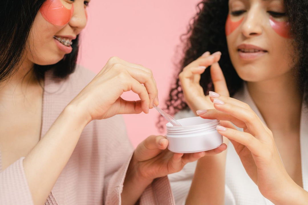 Women wearing pink salmon DNA skincare under-eye patches